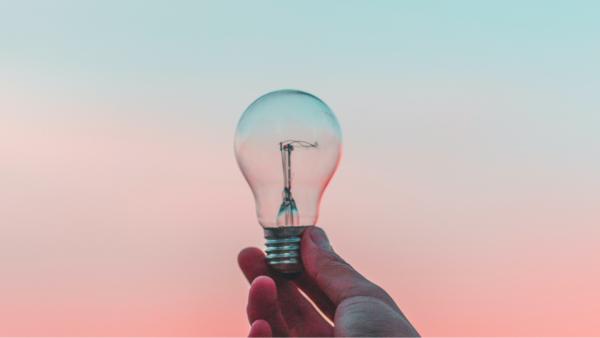 lightbulb being held in a hand